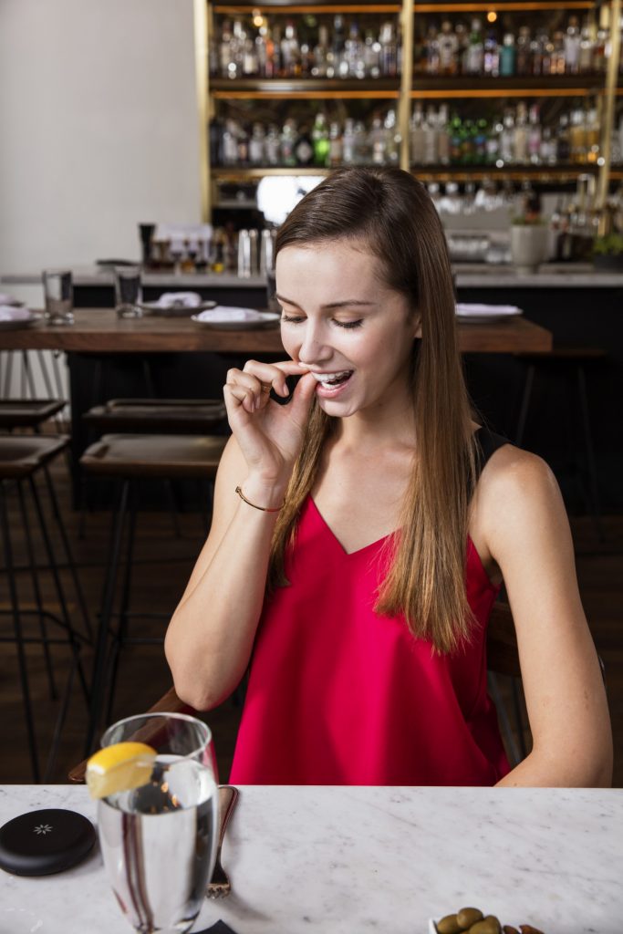 women with invisalign