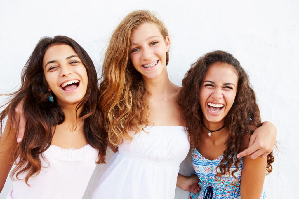 teen girls smiling