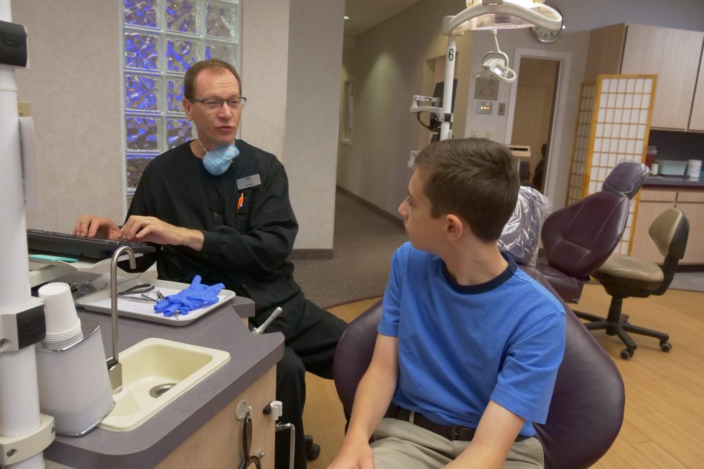 Dr. Clauss staff member with a patient