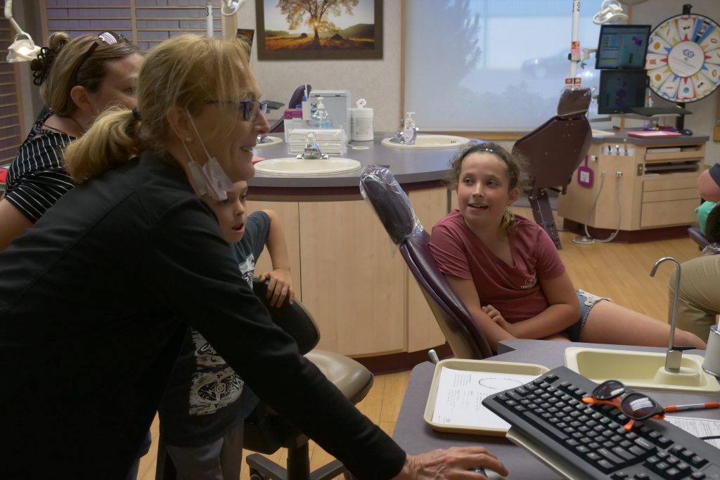 Dr. Clauss staff members with patients